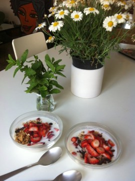 a photograph of a couple of local seasonal fruits and vegetables bowls on a white table